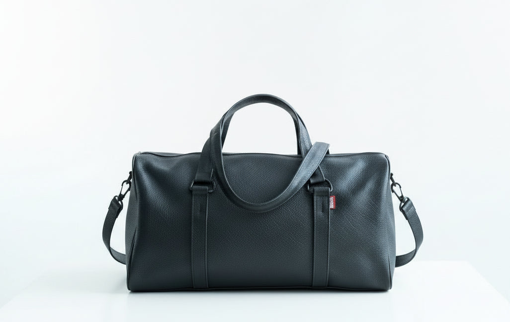 Black leather duffel bag. Leather lining, perfect travel bag or gym bag