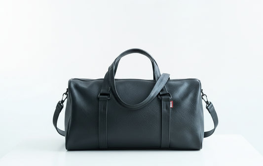 Black leather duffel bag. Leather lining, perfect travel bag or gym bag